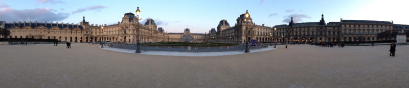 A panorama of the Louvre in Paris, France at sunset.