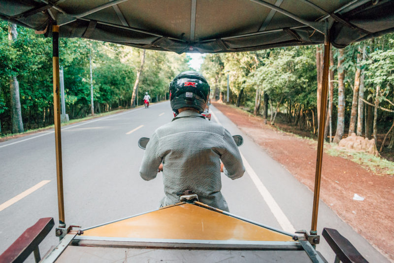 Riding around in my tuk-tuk in Cambodia.