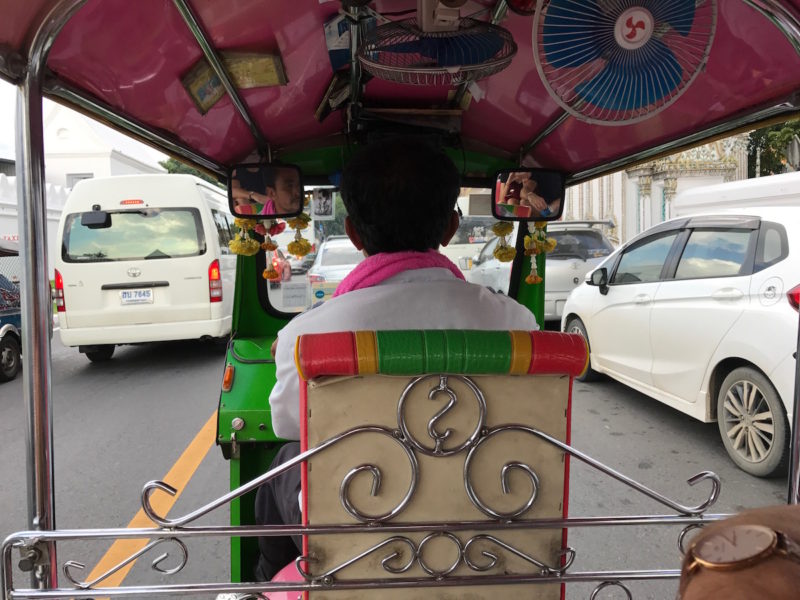 Riding a tuk tuk in Thailand.