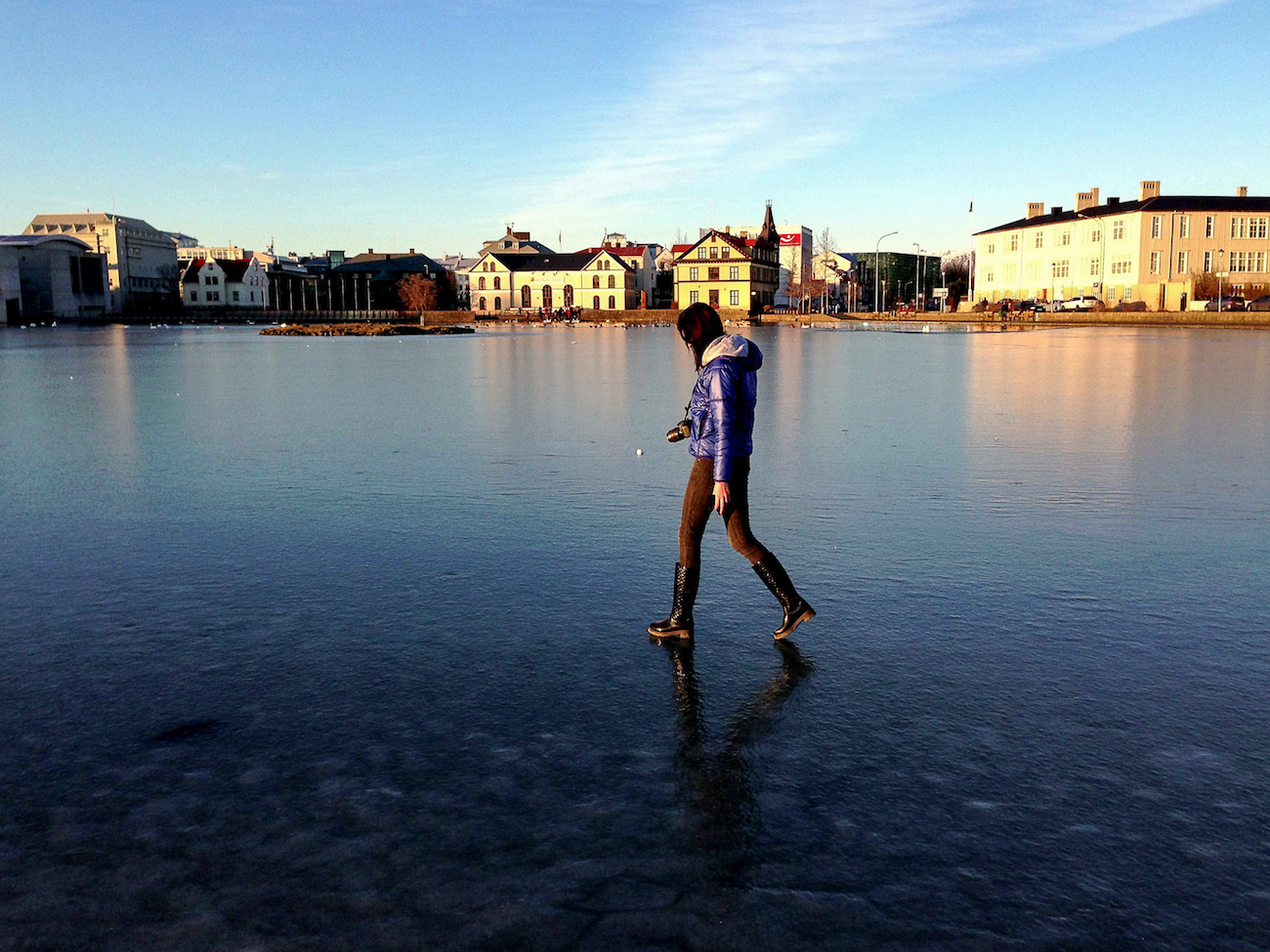 Tjornin, a frozen pond in Reykjavik.