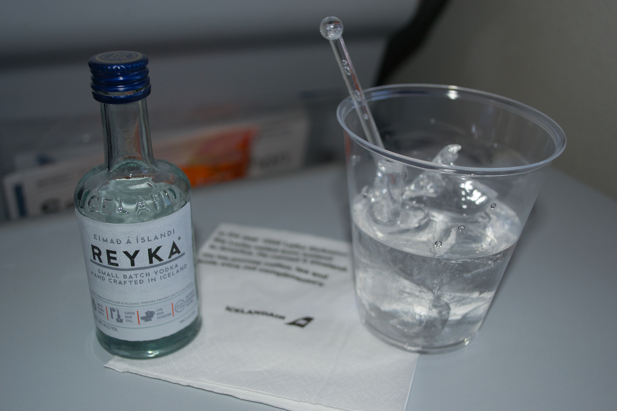 Drinking Reyka vodka on the plane.