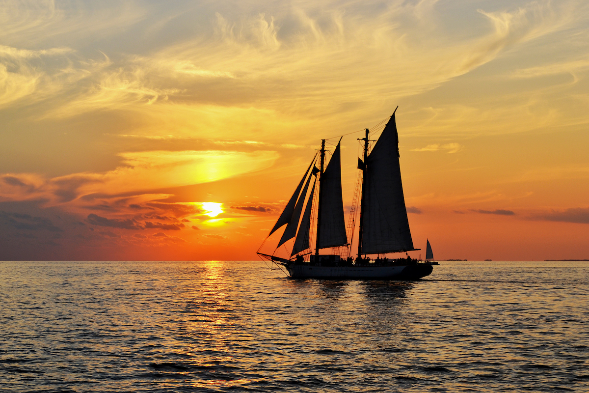 Sunset in Key West with a sail boat.