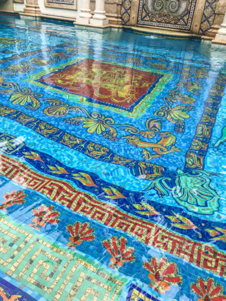 The colorful mosaic tiles up close of Gianni's pool.