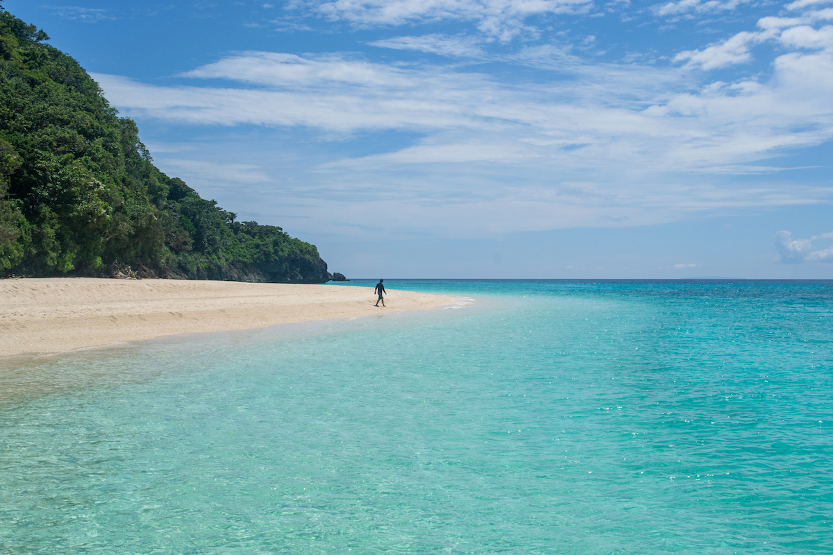 The blue water at Puka Beach in Boracay-a great stop to add to your Philippines itinerary.