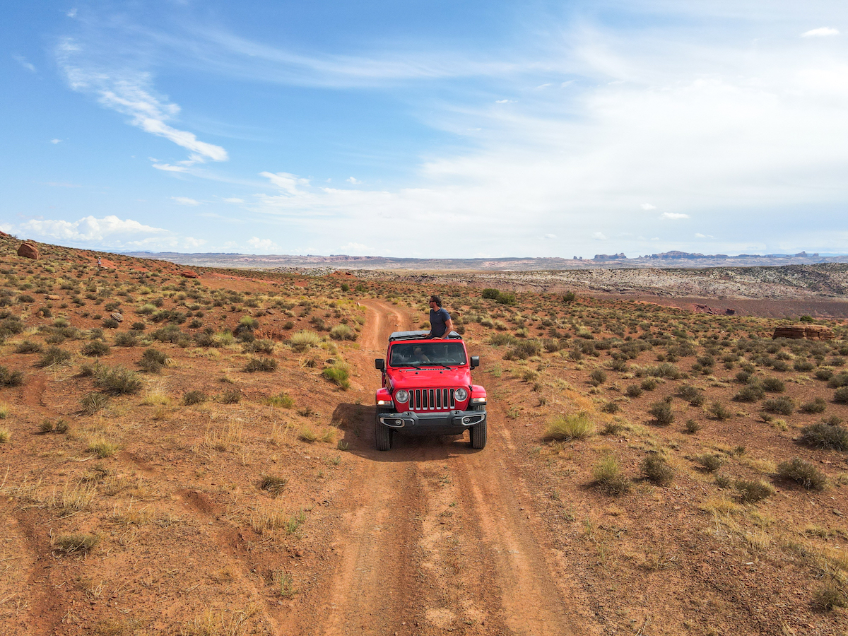 Taking some off-roading trails in Moab, Utah with our red Jeep Wrangler! 
