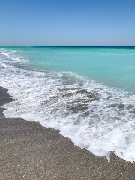 The turquoise water of the ocean on the Florida coast.