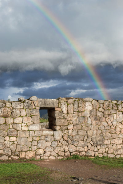 A rainbow over the walled ruins in Peru.
