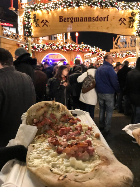 Eating Flammkuchen at the German Christmas Markets.