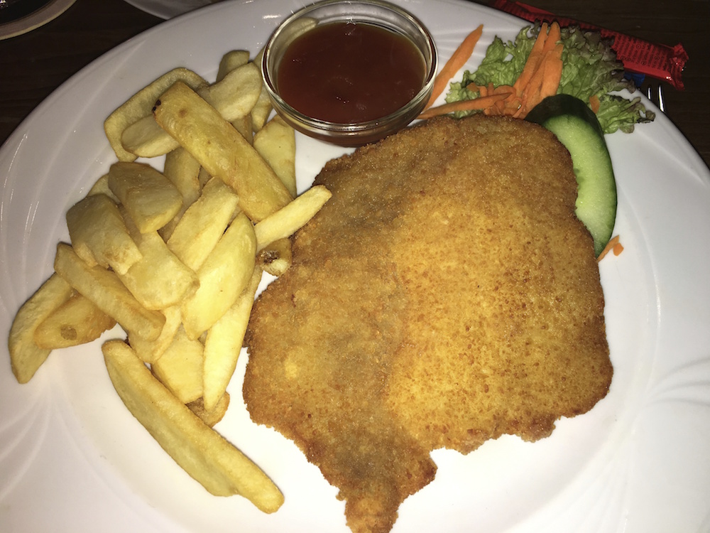 Schnitzel is a thin piece of breaded meat and a must-try food when figuring out what to eat in Germany!