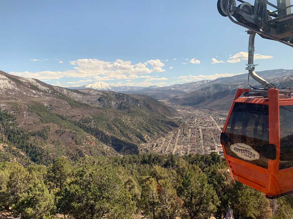 Things to do in Glenwood Springs: take the gondola to the top of the mountain for a view of the city!
