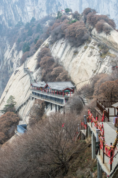 Hanging buildings on the side of a cliff in China.
