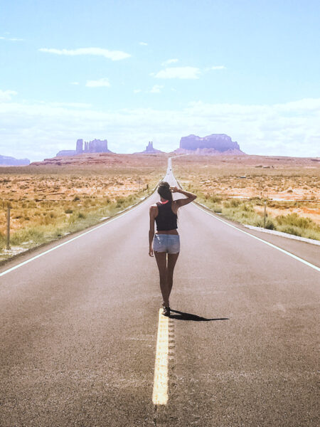 Walking down the road to Monument Valley on our American southwest road trip.