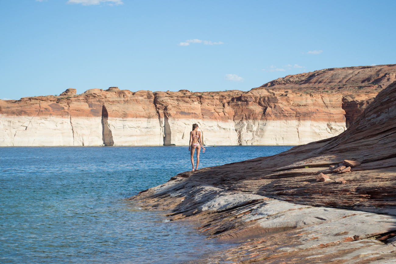The shores of Lake Powell and the two-toned canyon walls.