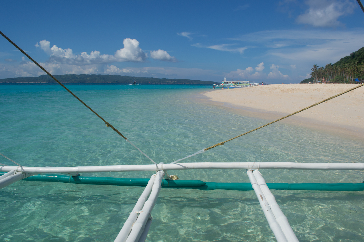 Exploring the beaches by taking a Boracay boat trip. 