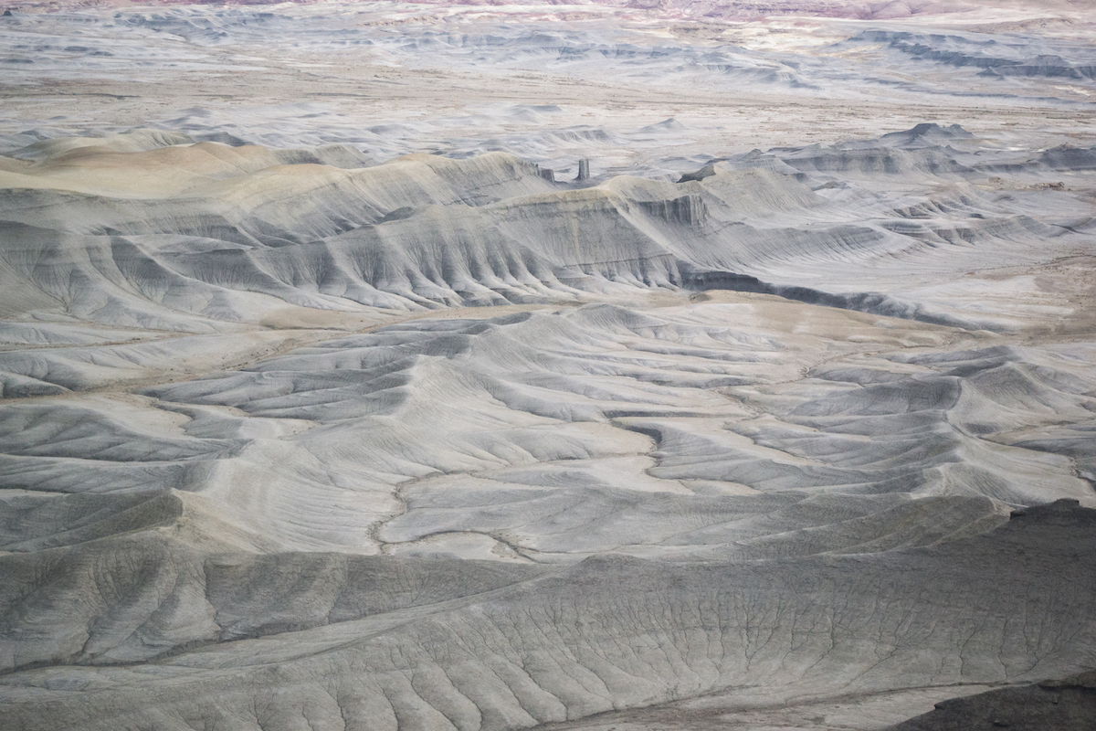 The valley floor of gray dunes in Utah.