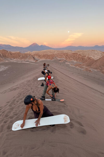 Waxing our boards for sandboarding.