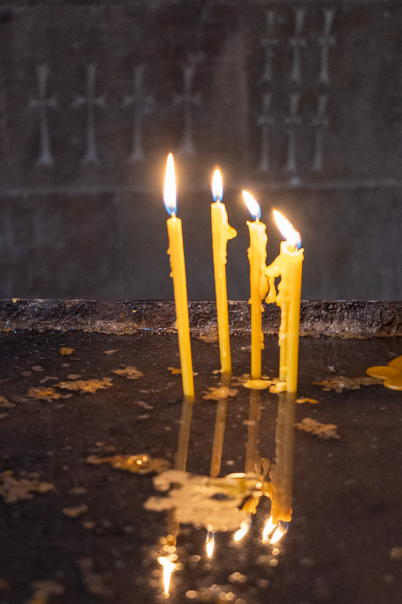 Lit candles at Noravank Monastery.