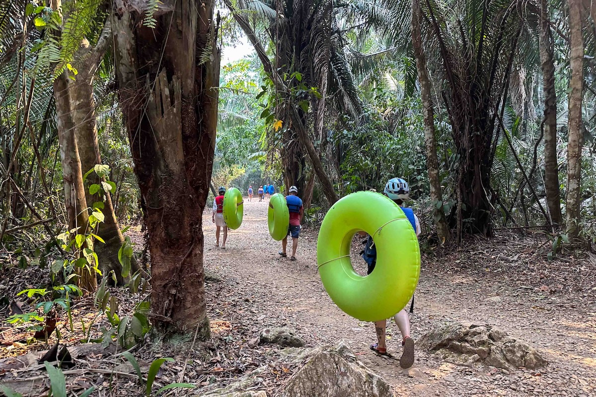 Walking through the jungle to the entrance of the river tubing in San Ignacio.