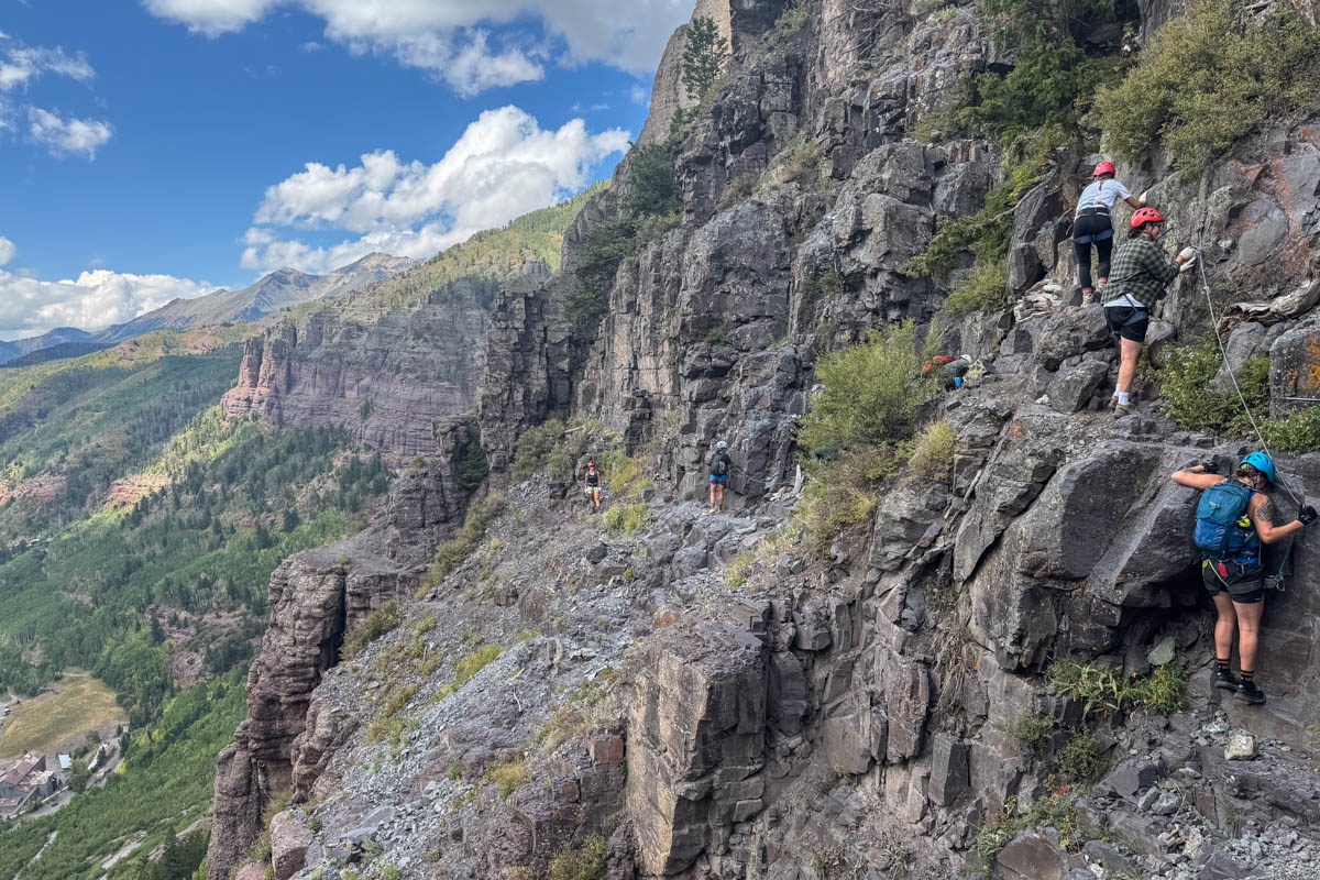Hiking along the rock cliff in Telluride, Colorado.